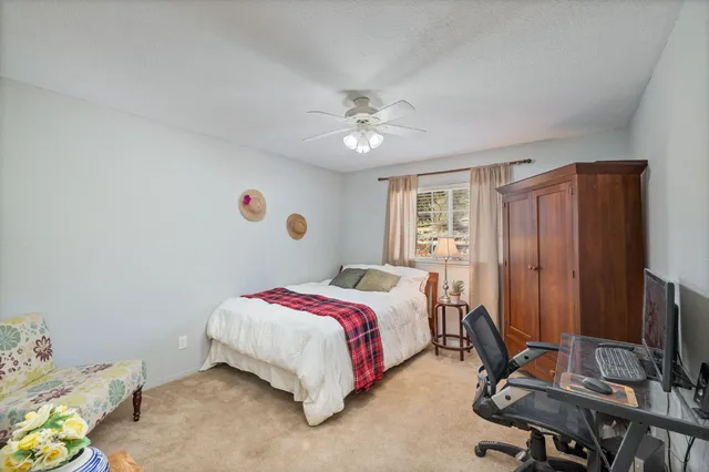 a view of a room with wooden floor and windows