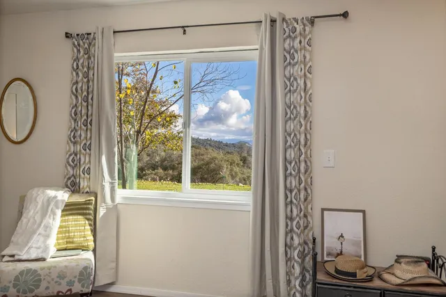 a view of a chairs and table in the balcony