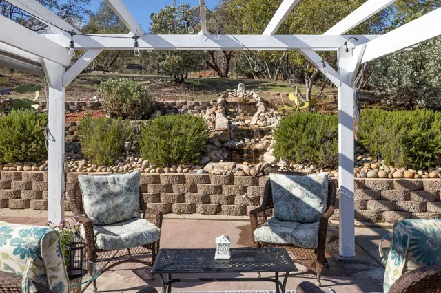 a view of a dining room with furniture wooden floor and chandelier