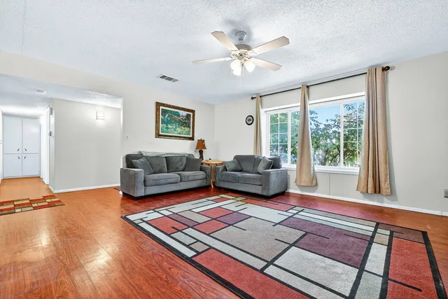 a living room with furniture and a window