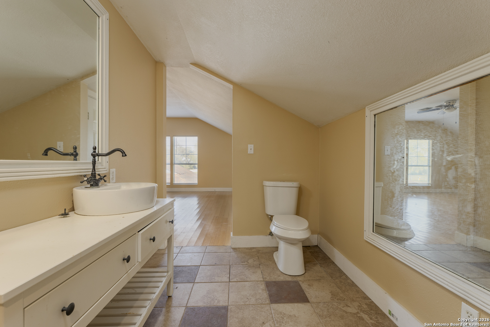 4419 State Highway 71 Columbus, TX 78934 - Photo 20 of 49 a bathroom with a double vanity sink toilet and shower