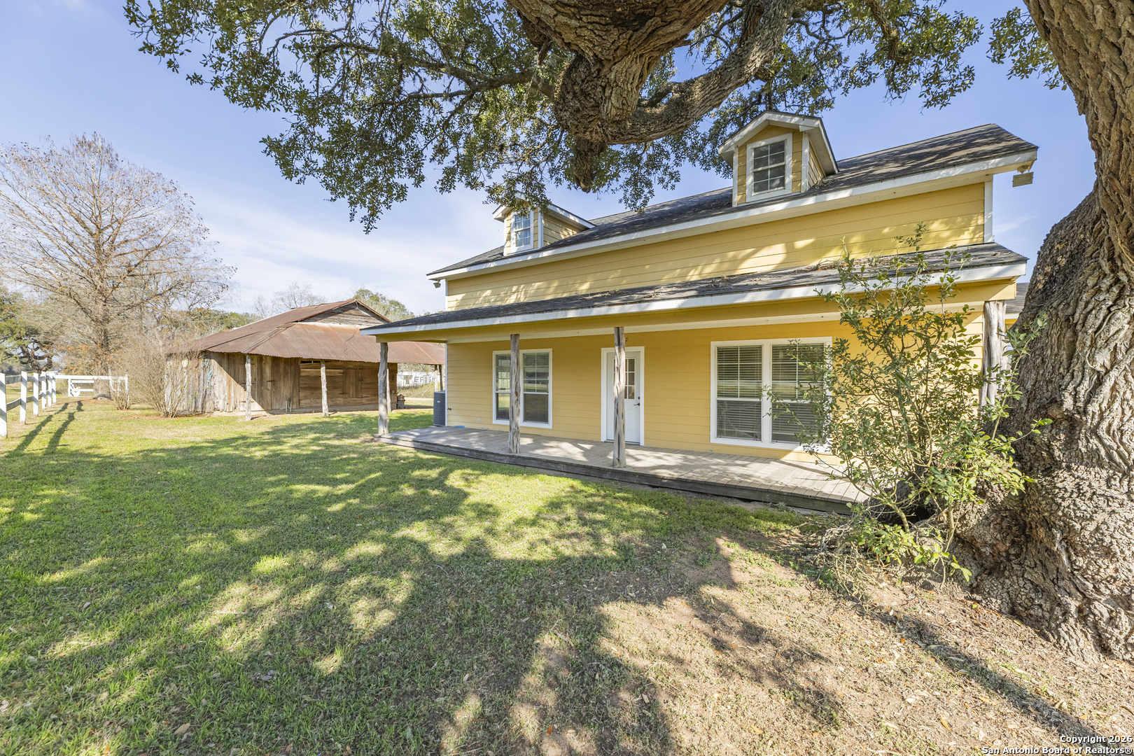 4419 State Highway 71 Columbus, TX 78934 - Photo 2 of 49 a front view of a house with a yard