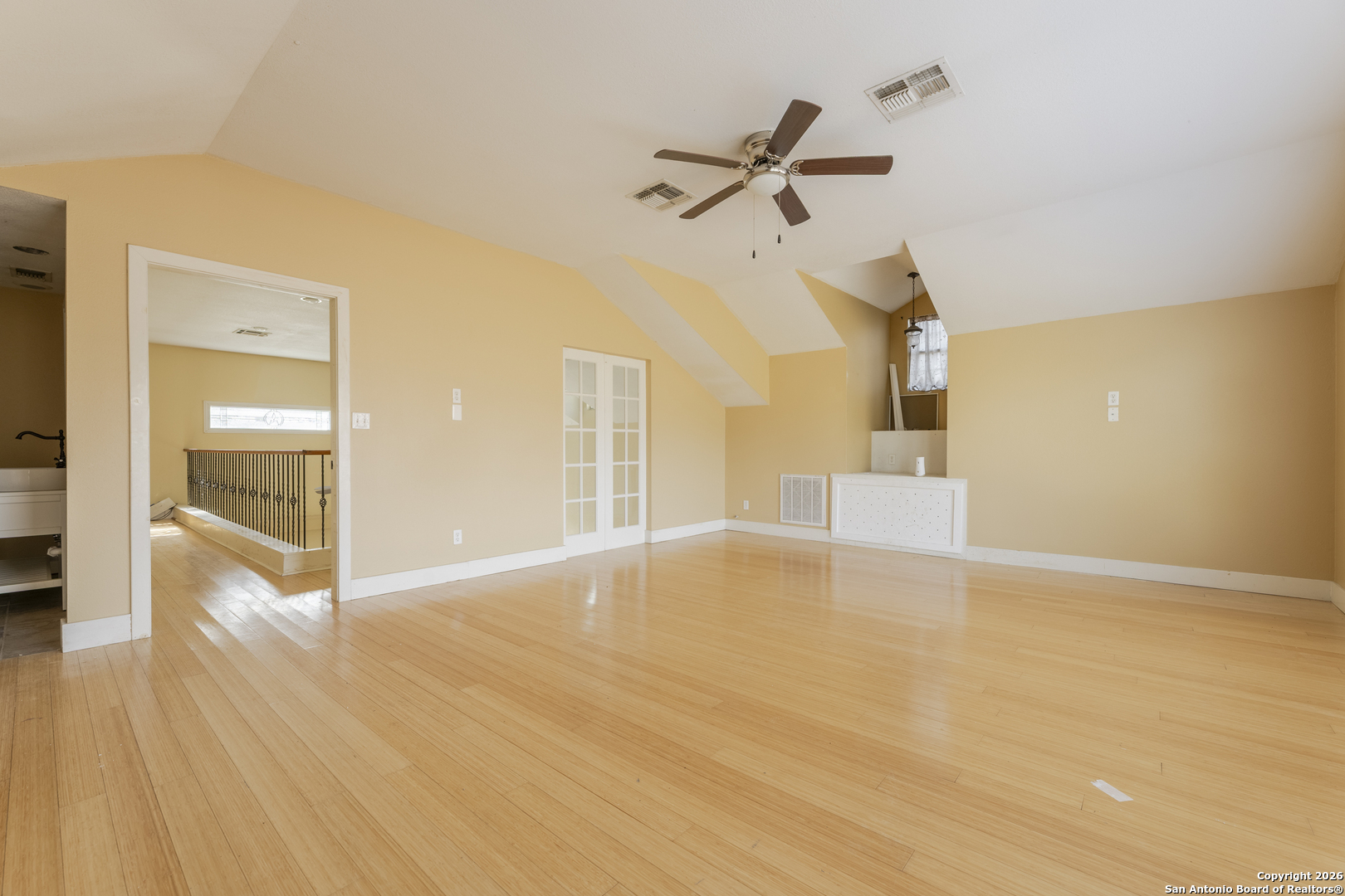 4419 State Highway 71 Columbus, TX 78934 - Photo 21 of 49 a view of empty room with wooden floor and fan