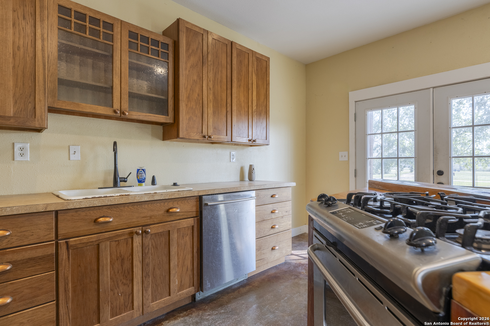 4419 State Highway 71 Columbus, TX 78934 - Photo 29 of 49 a kitchen with stainless steel appliances a stove and a microwave