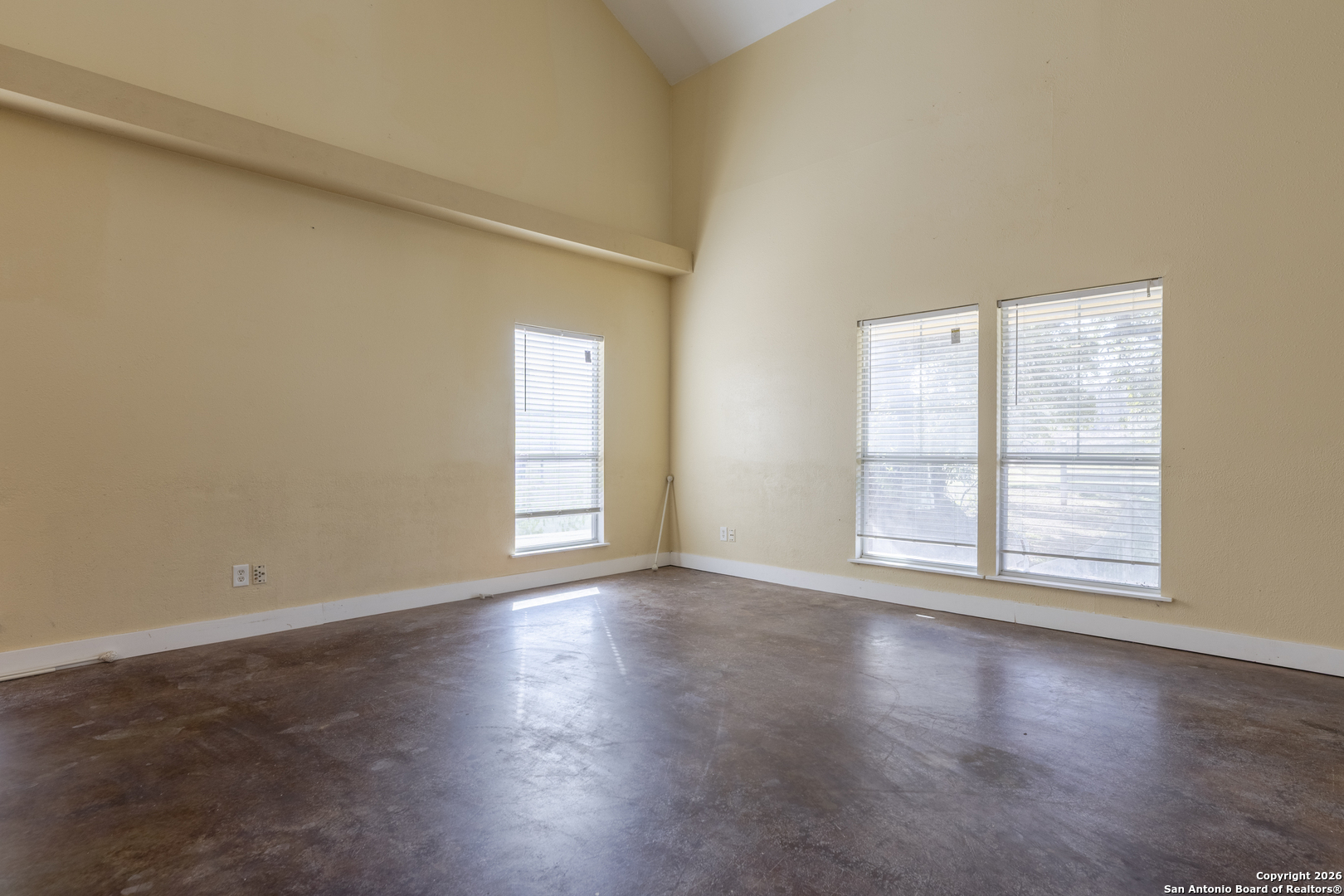 4419 State Highway 71 Columbus, TX 78934 - Photo 30 of 49 an empty room with wooden floor and windows