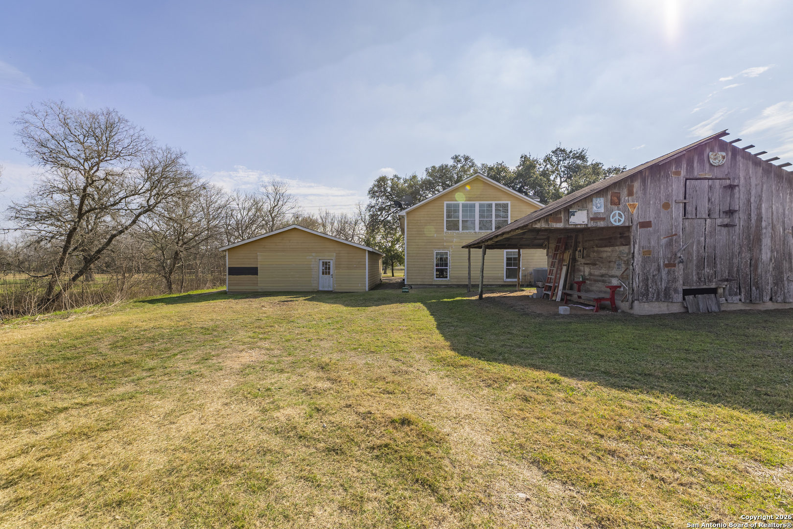4419 State Highway 71 Columbus, TX 78934 - Photo 36 of 49 a front view of a house with a yard and garage