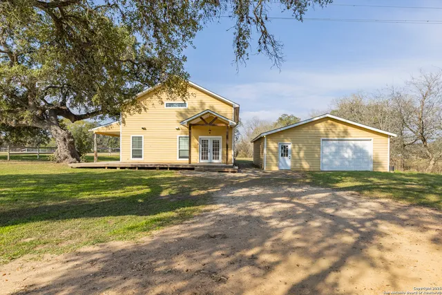 a view of a house with a yard