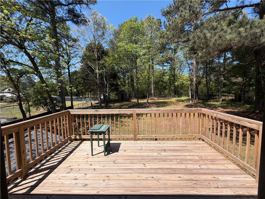 934 Bay Ridge Drive Lawrenceville, GA 30045 - Photo 25 of 78 a view of deck with swimming pool and trees