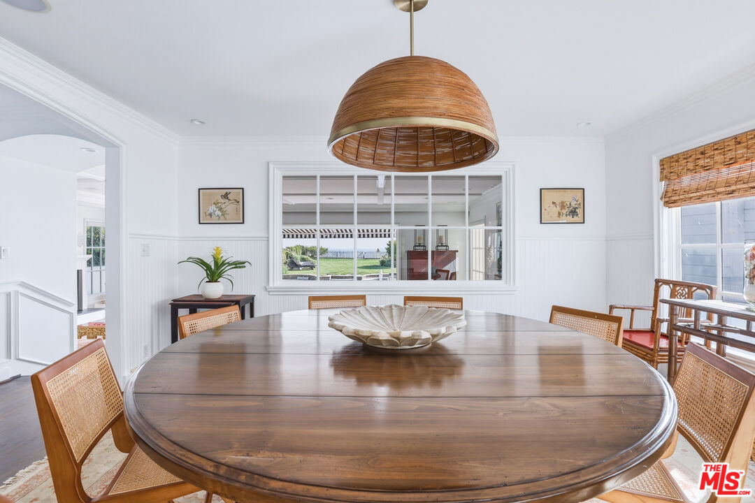 30810 Broad Beach Road Malibu, CA 90265 - Photo 22 of 55 a view of a dining room with furniture window and wooden floor