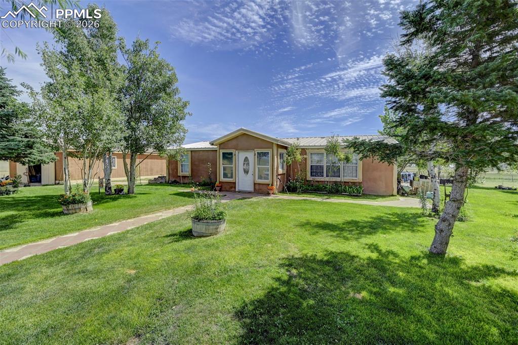 a front view of a house with a yard