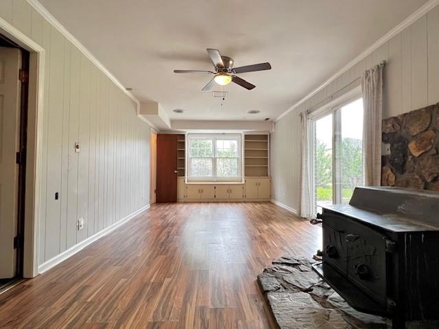 4541 Arcado Road Southwest Lilburn, GA 30047 - Photo 5 of 16 a workspace with wooden floor a ceiling fan and windows