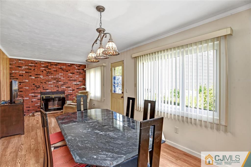 17 Brandeis Road Old Bridge, NJ 08859 - Photo 13 of 30 a view of a dining room with furniture window and wooden floor