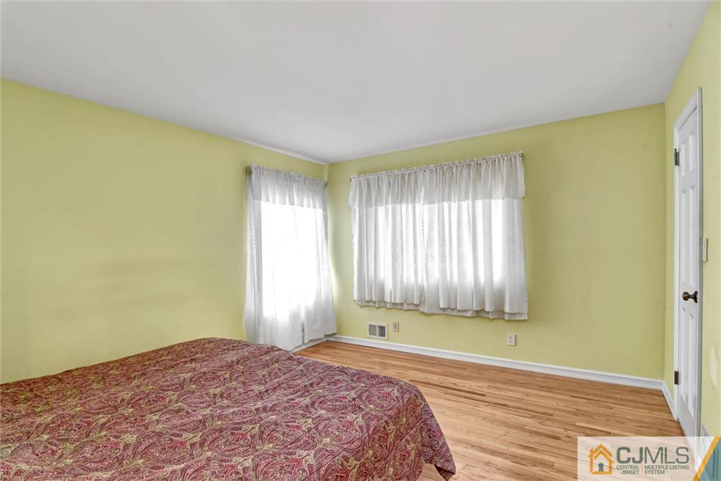 17 Brandeis Road Old Bridge, NJ 08859 - Photo 16 of 30 a bedroom with a bed and a window