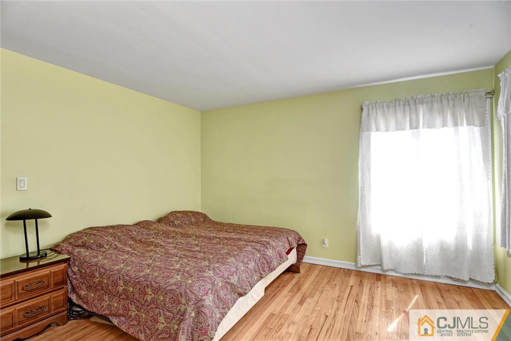 17 Brandeis Road Old Bridge, NJ 08859 - Photo 17 of 30 a bedroom with a bed and a window