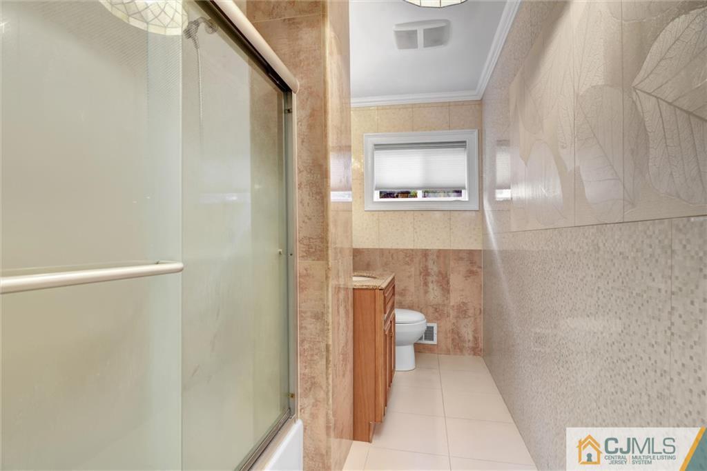 17 Brandeis Road Old Bridge, NJ 08859 - Photo 20 of 30 a bathroom with a toilet and a shower
