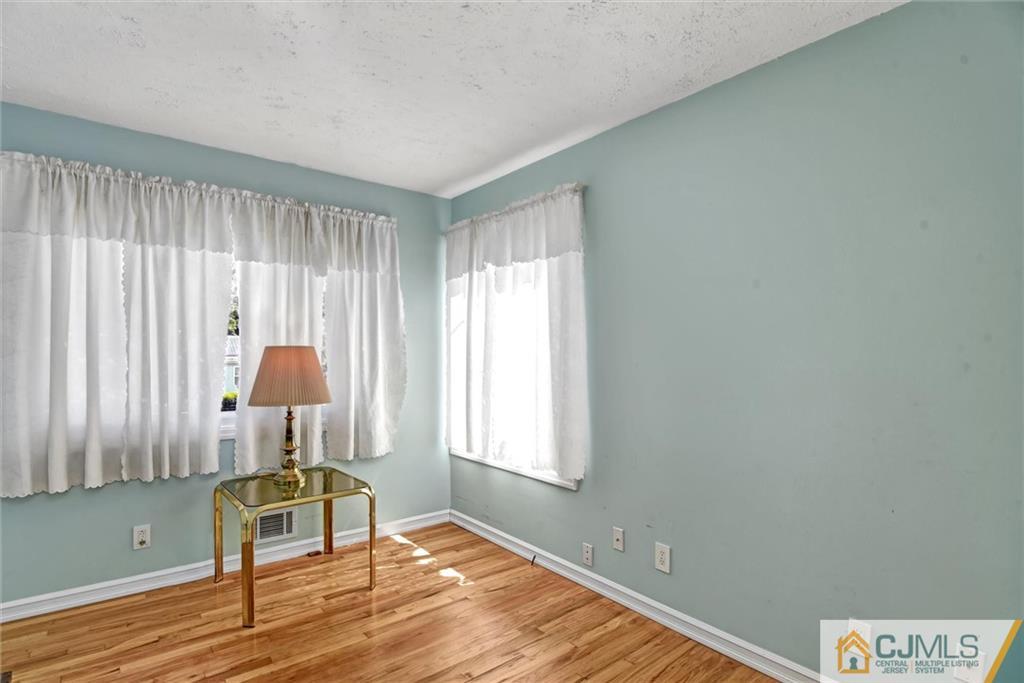 17 Brandeis Road Old Bridge, NJ 08859 - Photo 22 of 30 a view of a livingroom with wooden floor and a window