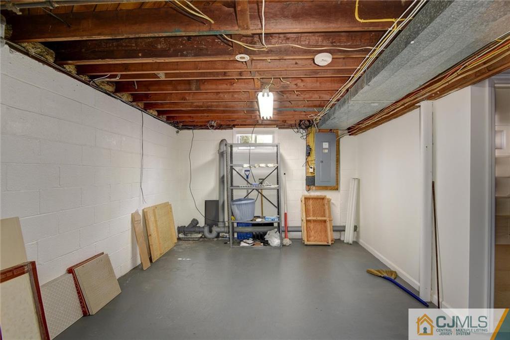 17 Brandeis Road Old Bridge, NJ 08859 - Photo 27 of 30 a view of storage and utility room with stairs