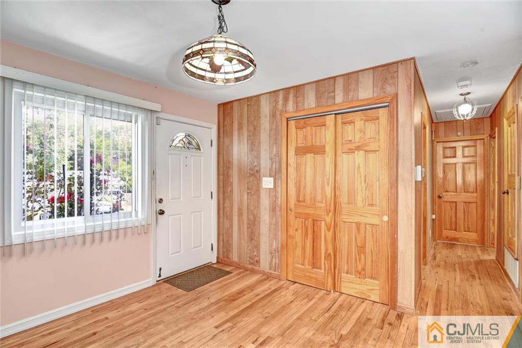 17 Brandeis Road Old Bridge, NJ 08859 - Photo 4 of 30 a view of an empty room with wooden floor and a window