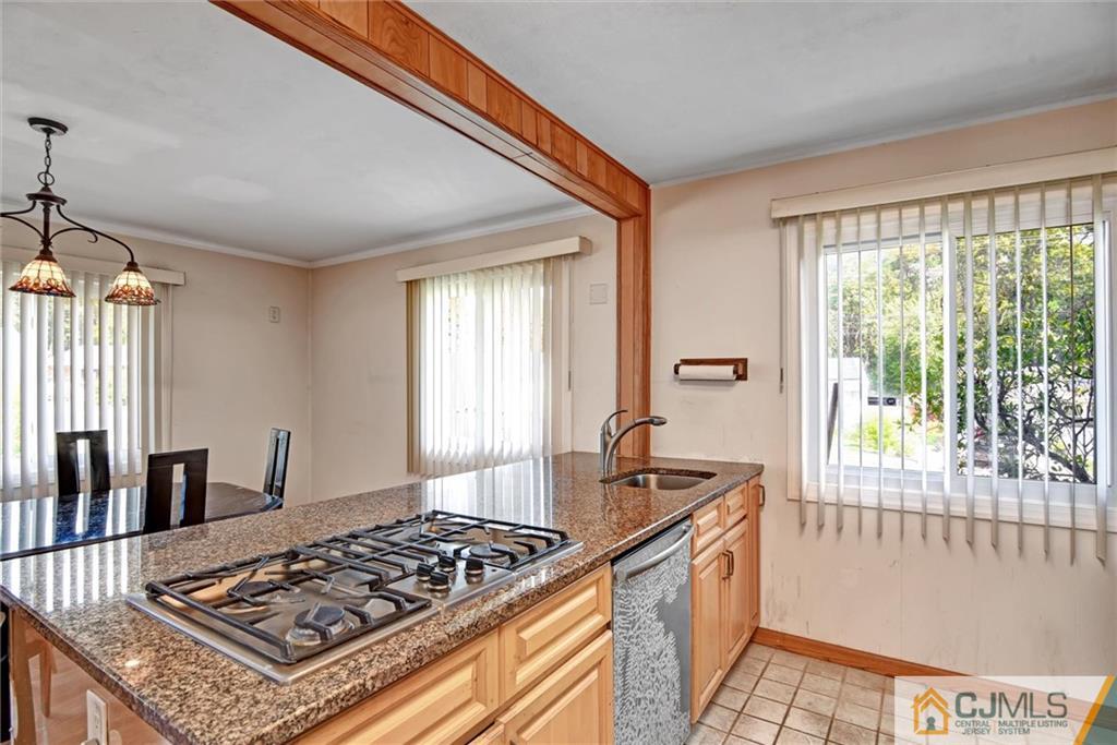 17 Brandeis Road Old Bridge, NJ 08859 - Photo 10 of 30 a kitchen with stainless steel appliances granite countertop a sink stove and refrigerator