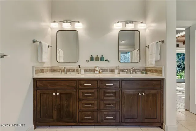 a bath room with a sink and a toilet