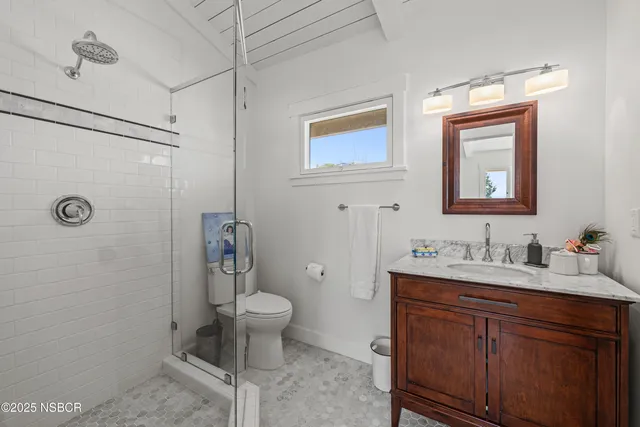 a view of a chairs and table in the patio