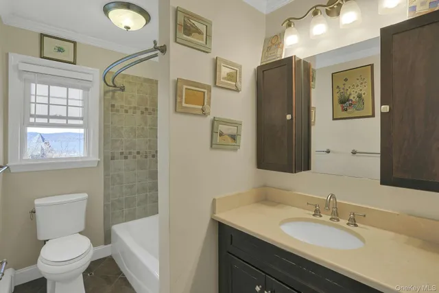 a view of room with window and ceiling fan