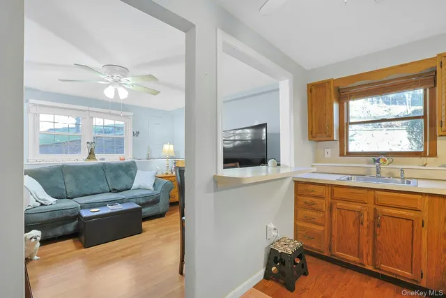 a view of a dining room with furniture and chandelier
