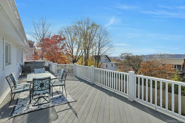 a view of a balcony with furniture
