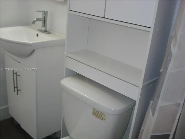 a bathroom with a sink and mirror