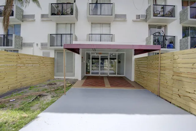 a view of a brick house with an outdoor space