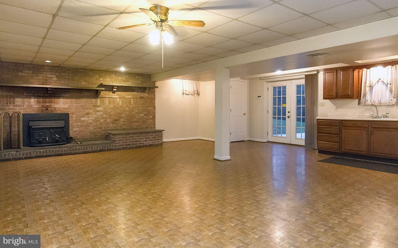 3905 Church Road Manchester, MD 21102 - Photo 5 of 30 LL walk out fam rm w/wood stove