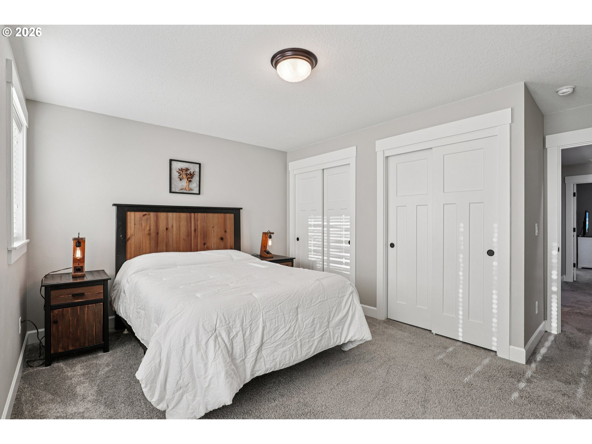 7346 South 13th Street Ridgefield, WA 98642 - Photo 18 of 38 a bedroom with a bed and a cabinets