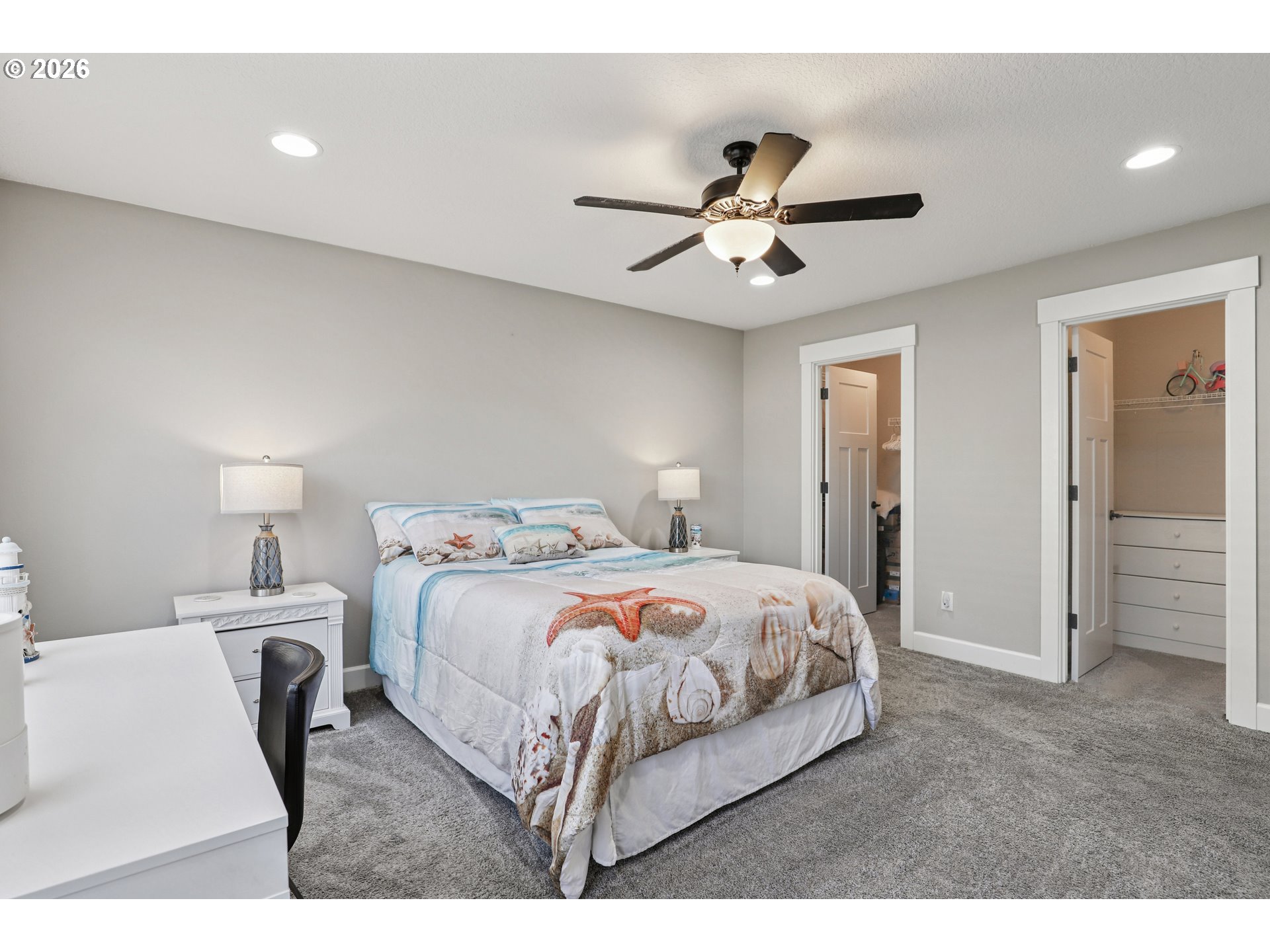 7346 South 13th Street Ridgefield, WA 98642 - Photo 21 of 38 a bedroom with a bed and a ceiling fan
