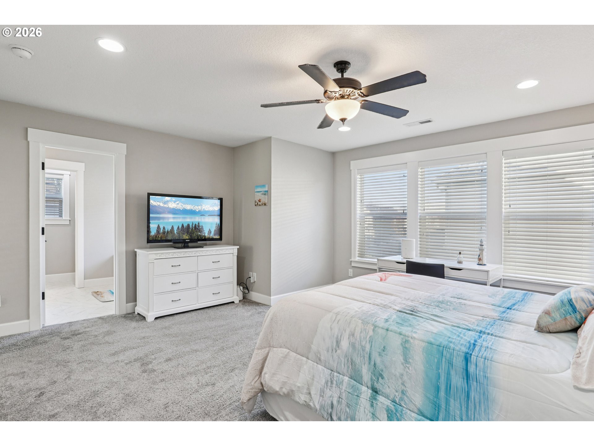 7346 South 13th Street Ridgefield, WA 98642 - Photo 22 of 38 a bedroom with a bed and large windows