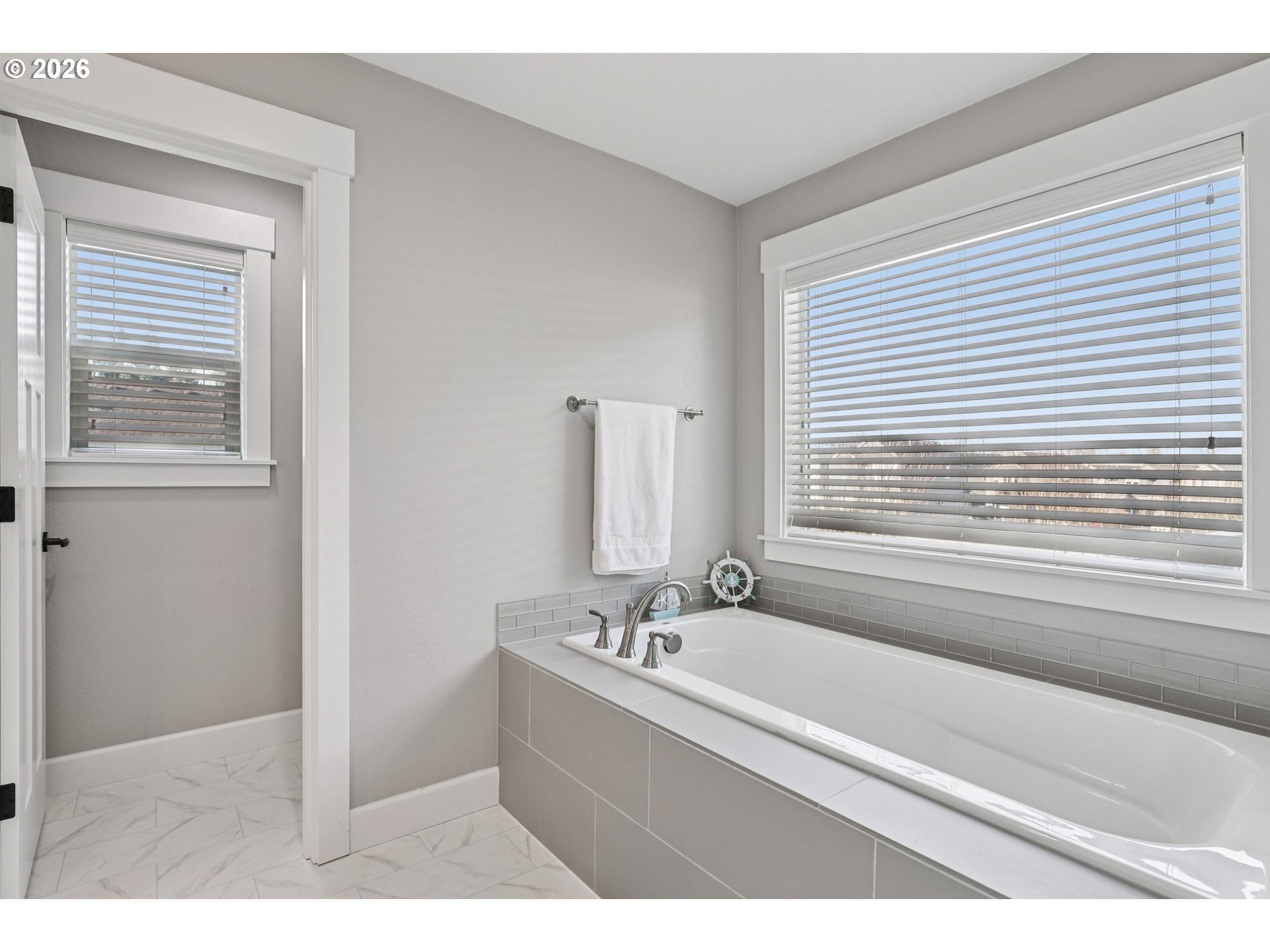 7346 South 13th Street Ridgefield, WA 98642 - Photo 23 of 38 a bathroom with a bathtub and a sink