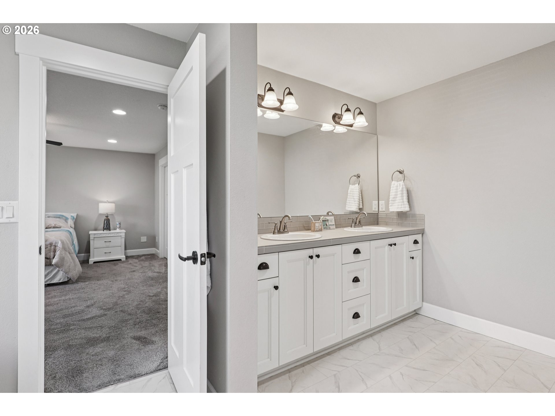 7346 South 13th Street Ridgefield, WA 98642 - Photo 24 of 38 a bathroom with a granite countertop sink and a mirror