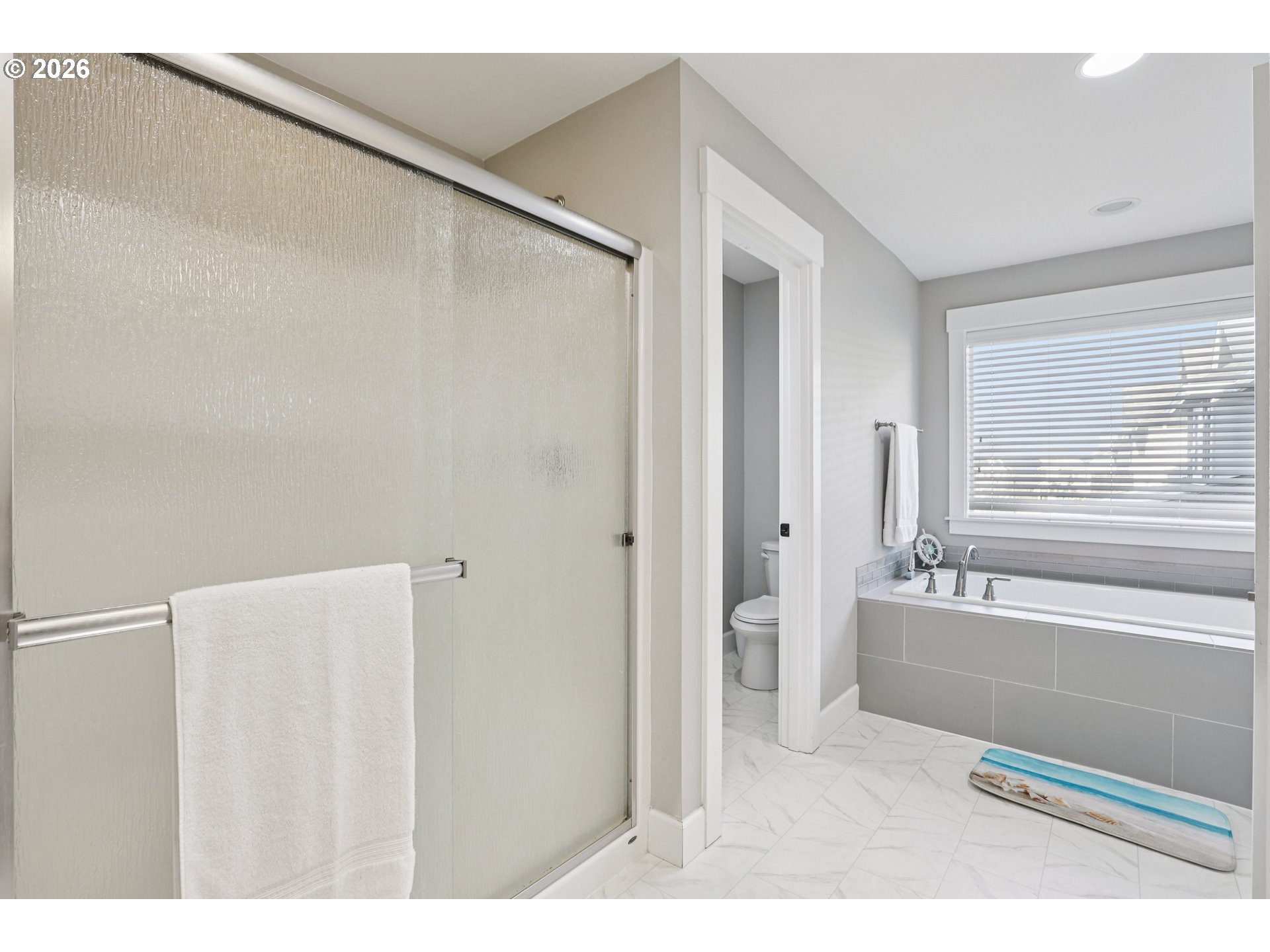 7346 South 13th Street Ridgefield, WA 98642 - Photo 25 of 38 a bathroom with a bathtub and a shower