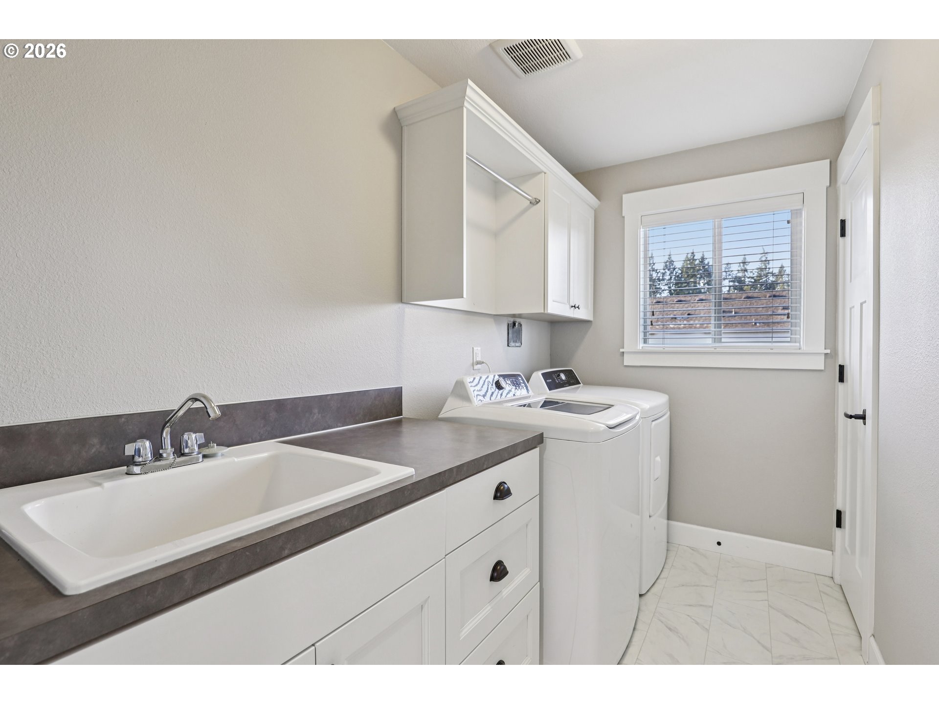 7346 South 13th Street Ridgefield, WA 98642 - Photo 28 of 38 a utility room with sink dryer and washer