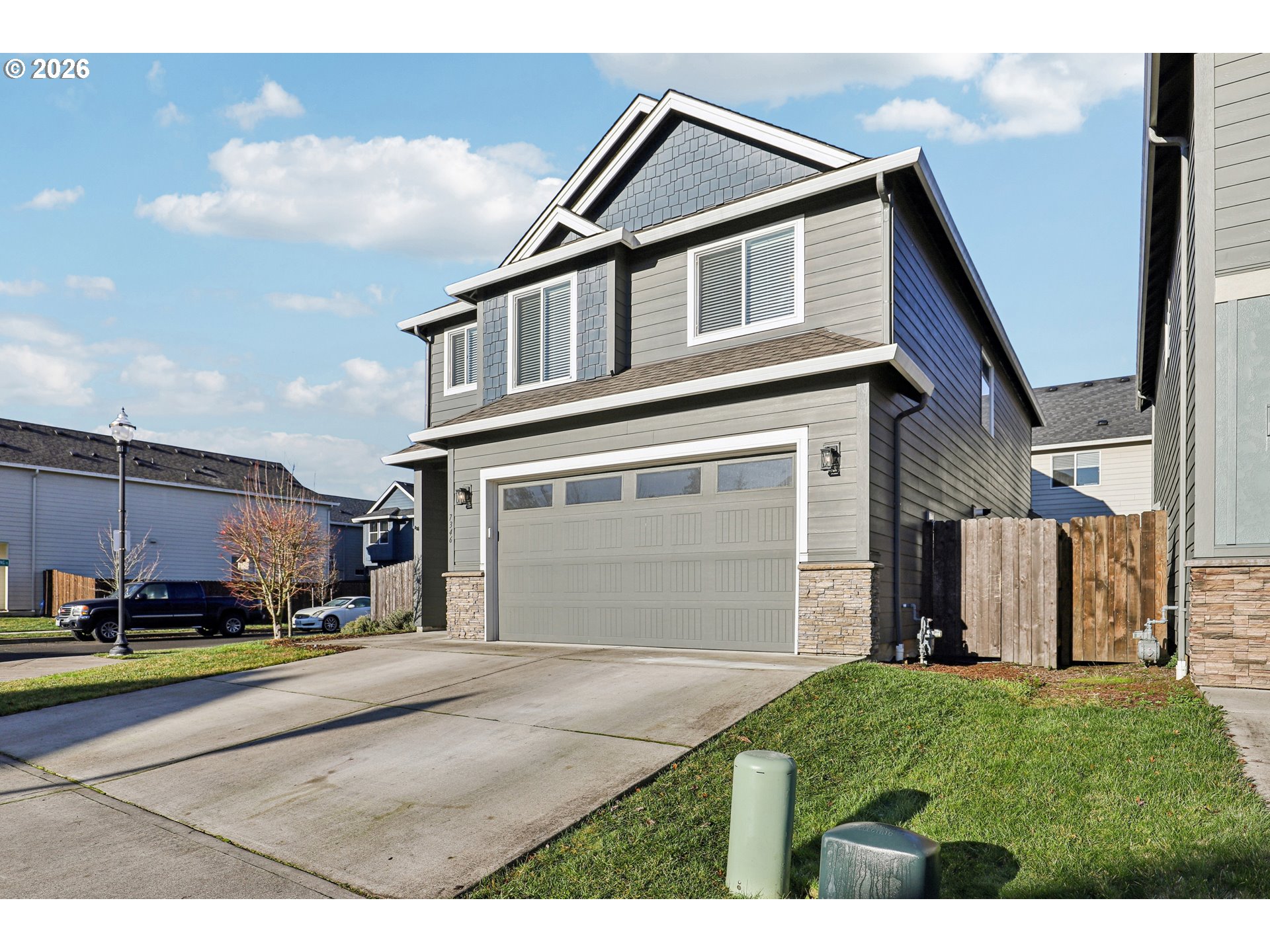 7346 South 13th Street Ridgefield, WA 98642 - Photo 37 of 38 a front view of a house with a yard and garage