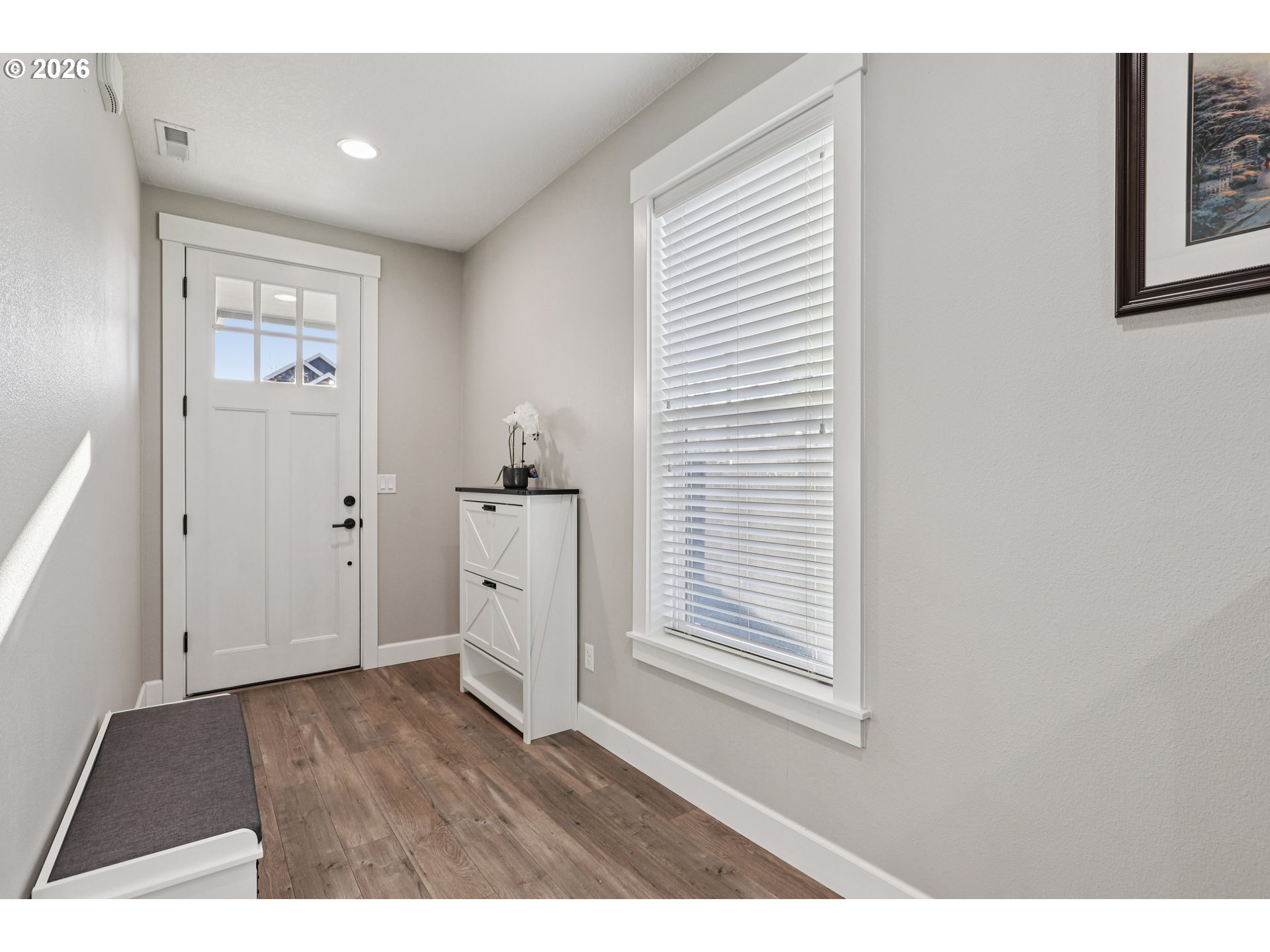 7346 South 13th Street Ridgefield, WA 98642 - Photo 4 of 38 an empty room with wooden floor and windows