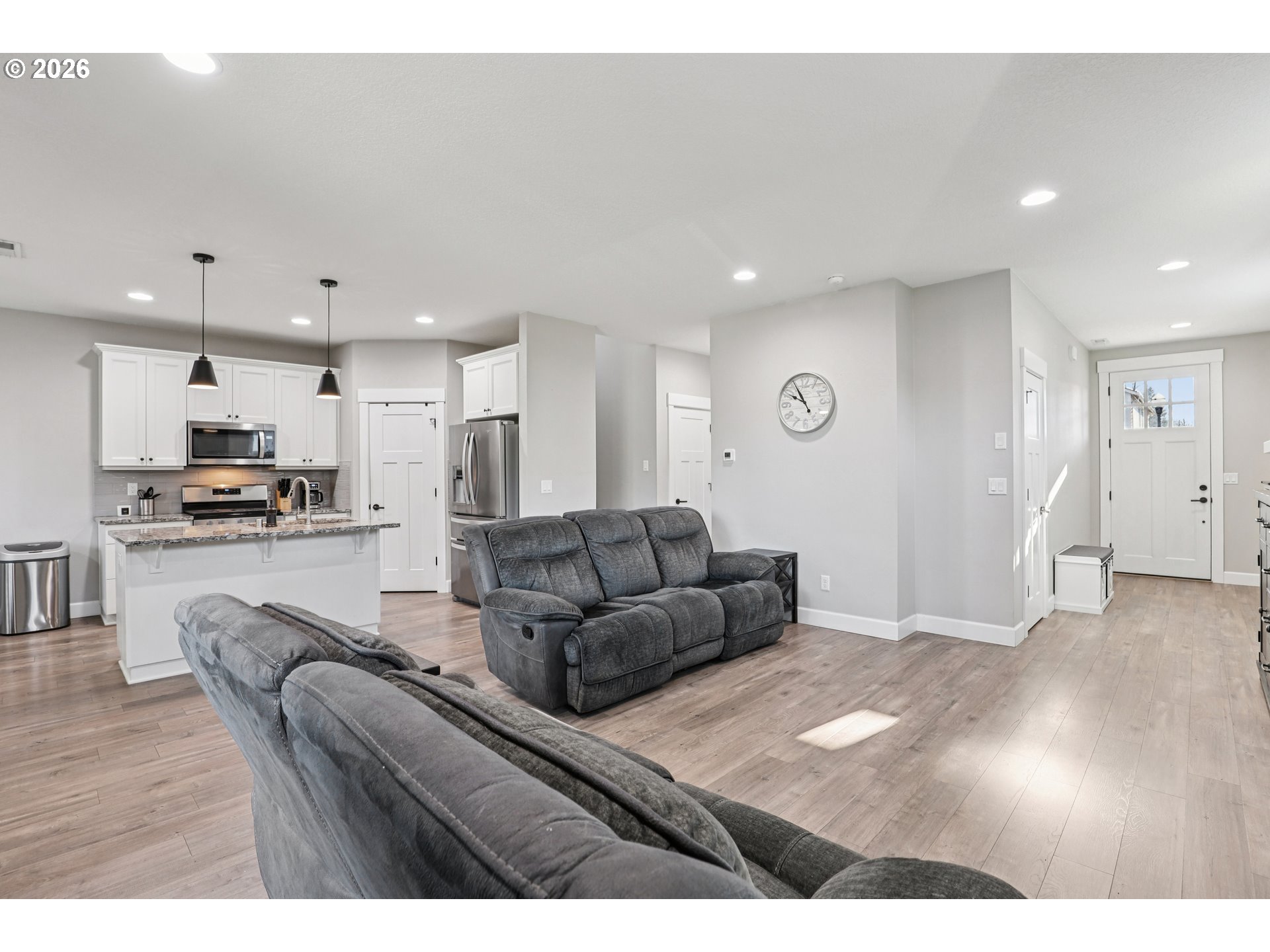 7346 South 13th Street Ridgefield, WA 98642 - Photo 7 of 38 a living room with furniture and kitchen view