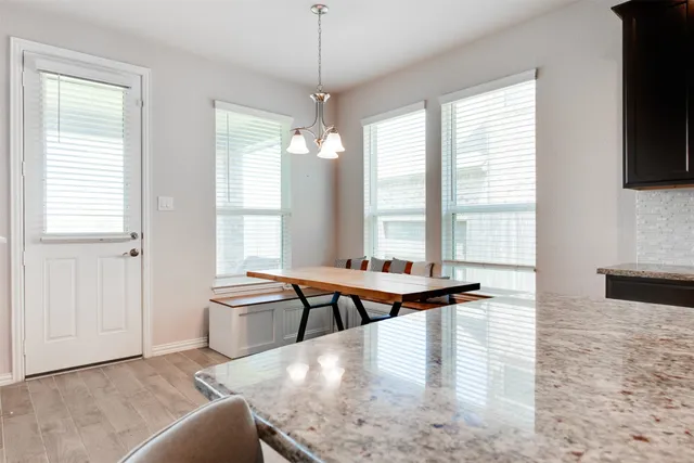 a view of a living room and chandelier