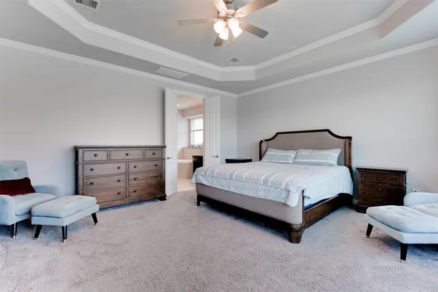 a bedroom with a bed and a couch