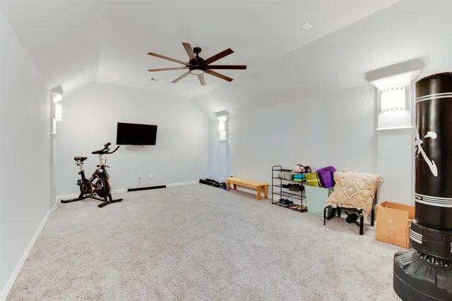 a room with furniture and white walls