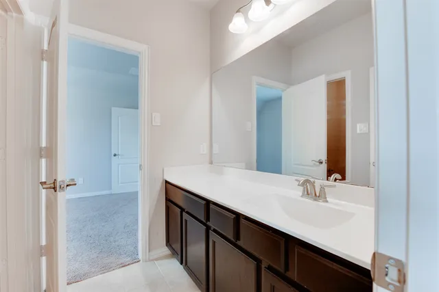 a bathroom with a sink double vanity and a mirror