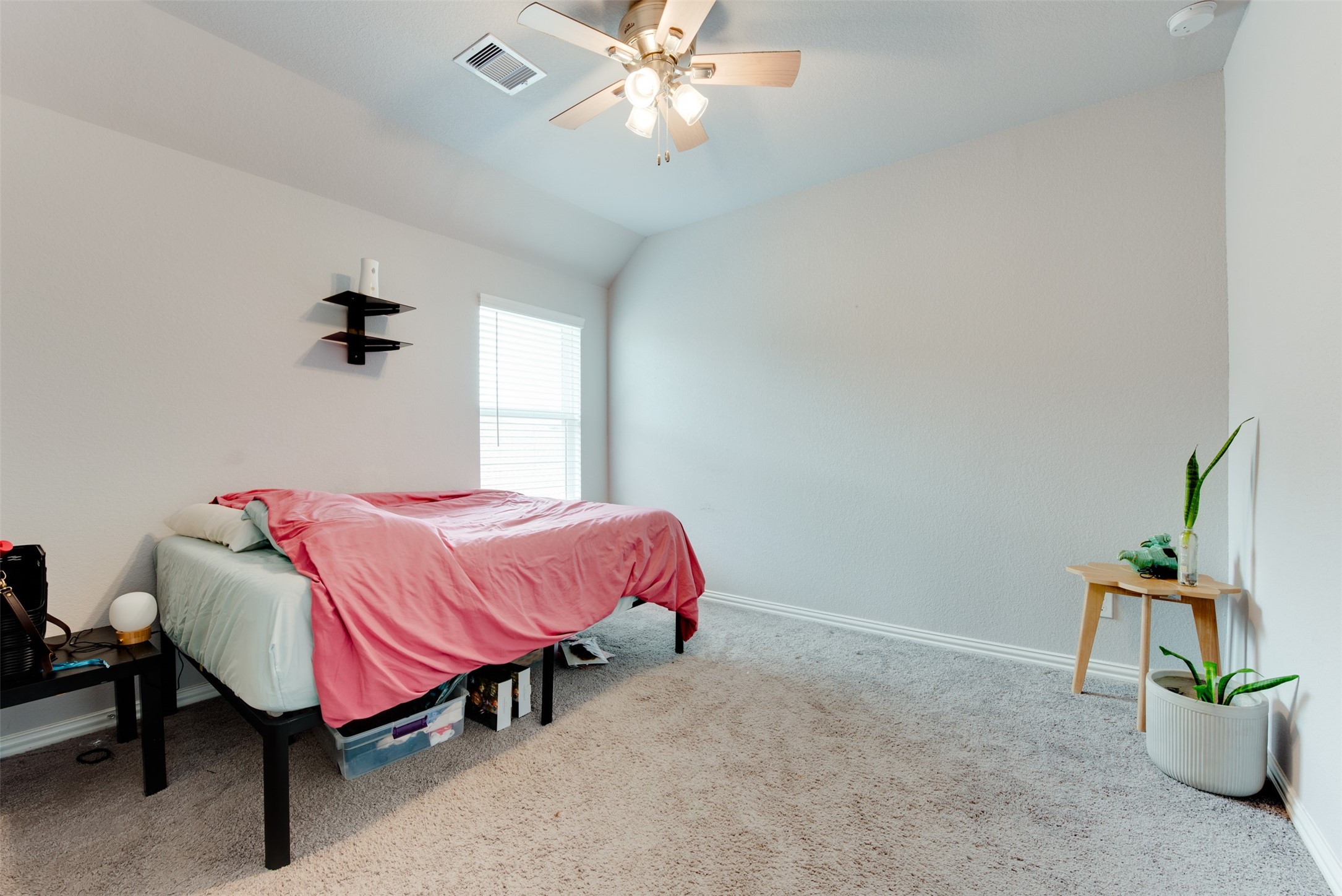 4310 Markstone Ridge Lane Rosharon, TX 77583 - Photo 37 of 40 a bedroom with a bed and a chandelier