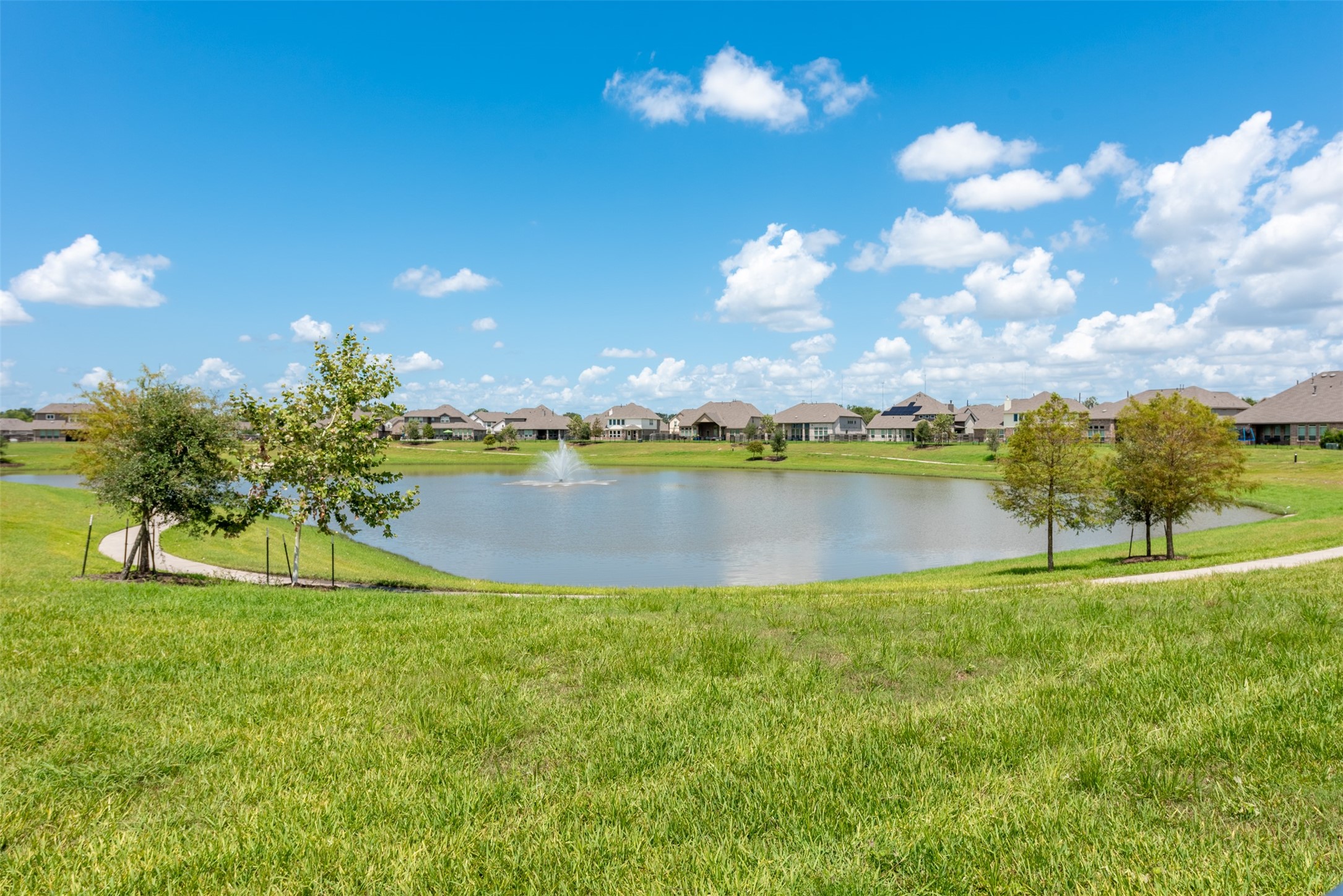 4310 Markstone Ridge Lane Rosharon, TX 77583 - Photo 40 of 40 a view of a lake with houses in the back