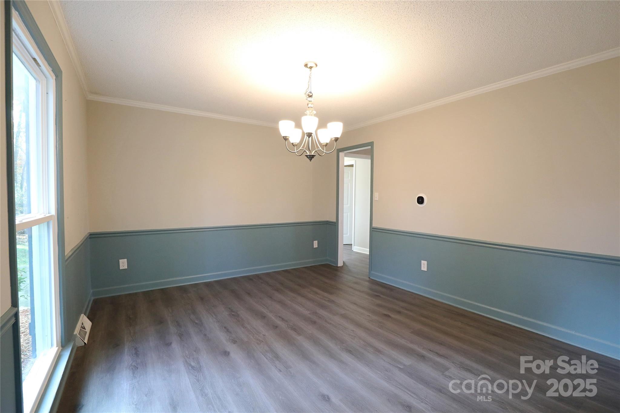 14027 Hackamore Drive Matthews, NC 28105 - Photo 11 of 29 wooden floor and window in an empty room