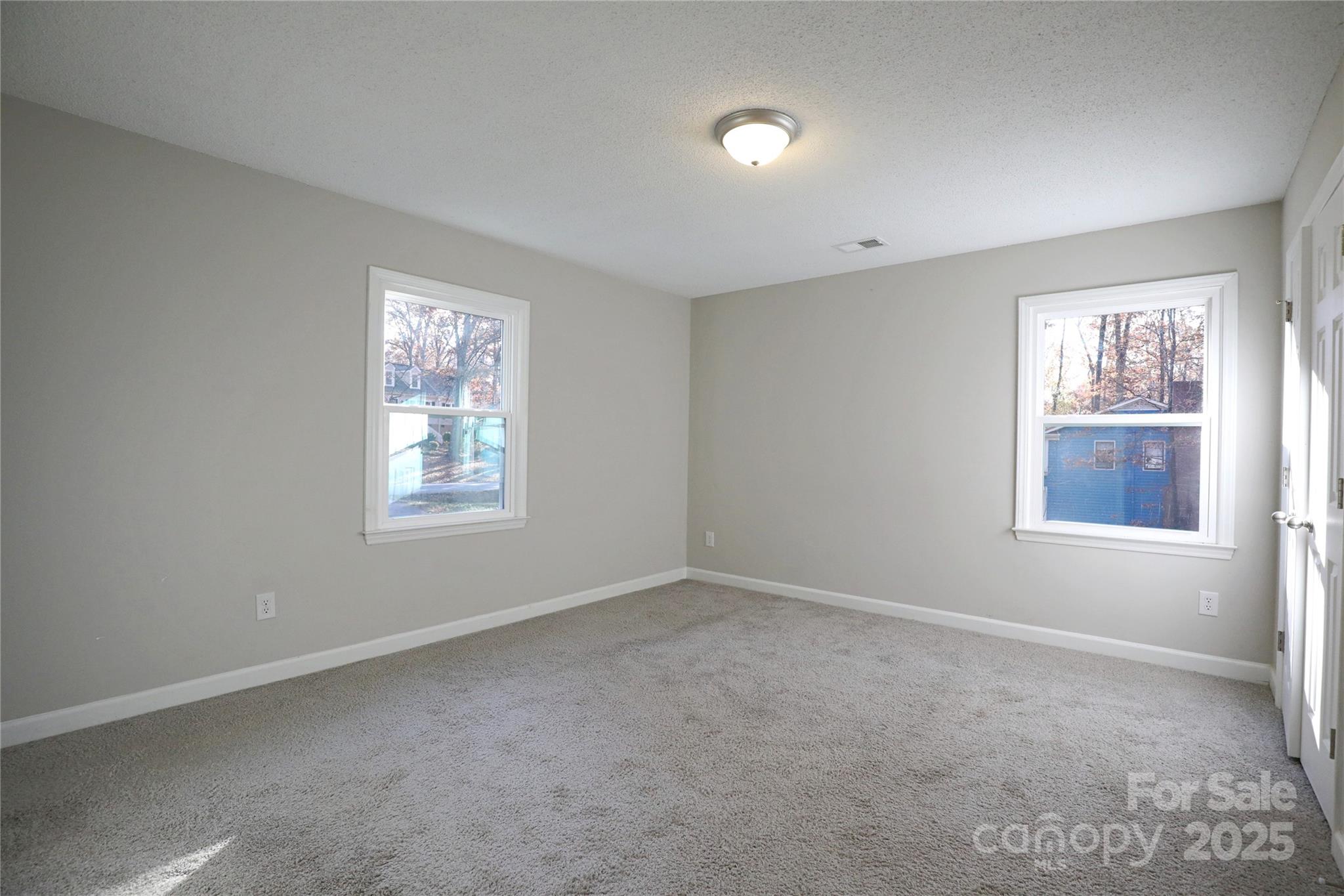 14027 Hackamore Drive Matthews, NC 28105 - Photo 16 of 29 an empty room with windows