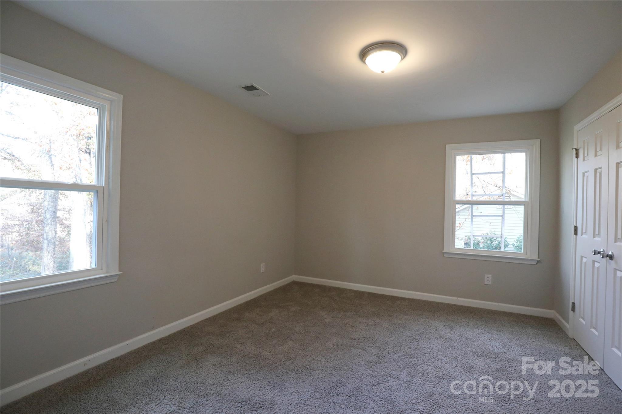 14027 Hackamore Drive Matthews, NC 28105 - Photo 21 of 29 an empty room with a window